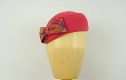 Brilliant pink velour beret with Irish tweed bow.