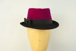 Striking velour trilby in magenta and black with ribbon trim.