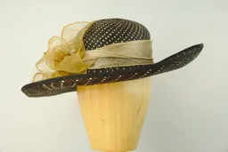 Cream and black panama straw hat with gold organza trim.