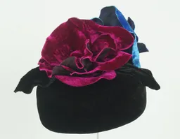 Velvet percher with vibrant pink and turquoise velvet flowers.